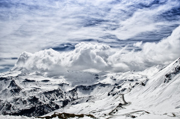 Beautiful view of Alps mountains. Snowy peaks in clouds. National Park Hohe Tauern, Austria.