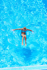 Girl swimming in pool