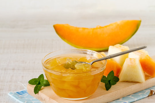Cantaloupe melon jam in a glass bowl on a table