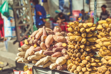 Street Food in Saigon, Vietnam. Sweet potato and banana for sale