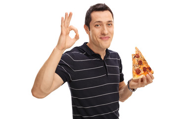 Man eating pizza and making an ok gesture
