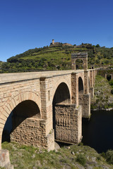Roman bridge over the Tajo river in Alcantara, Extremadura, Spain.(In the top view of the town of Alcantara)