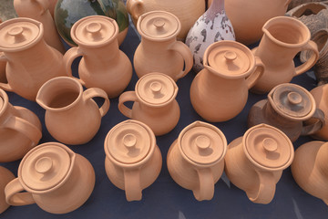 SLAVGOROD, BELARUS - AUGUST 14: Fair exhibition of handicrafts. pottery small and large jugs August 14, 2016 in Slavgorod, Belarus .