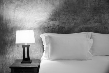 lamp and bed in the bedroom, black and white color.