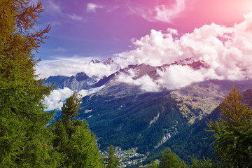 Obraz premium beautifull cloudy sunrise in the mountains with snow ridge. Alps. Switzerland, Trek near Matterhorn mount.
