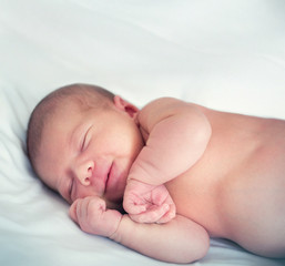 smiling in his sleep newborn baby