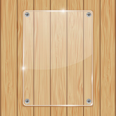 Transparent acrylic plate on wooden background