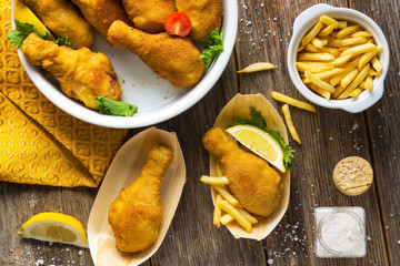 Fried chicken drumstick  on wooden background.
