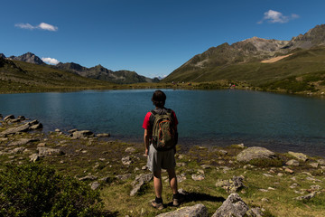 Fototapeta premium Wanderer enjoys the beauty of nature in the mountains of Tyrol Austria