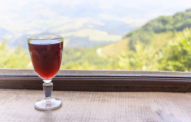 Glass of wine on the windowsill.