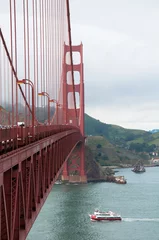 Fotobehang San Francisco, California, USA - APRIL 22, 2016:  Ferry ship under Golden Gate Bridge, documentary editorial. © mizzick
