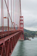San Francisco, California, USA - APRIL 22, 2016:  Tourists walking on Golden Gate Bridge, documentary editorial.