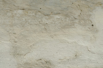 Wall fragment with scratches and cracks