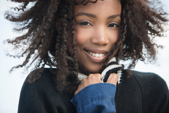 Young woman feeling cold in wind