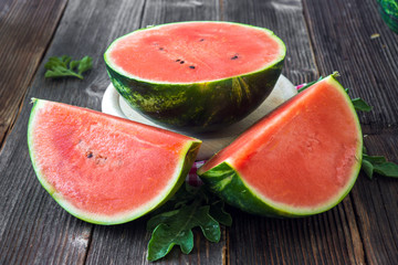 Fresh sliced watermelon on wooden background