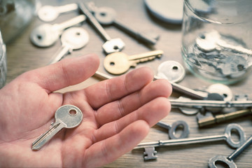 Man's hand holding key