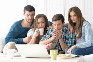 happy friends and  laptop