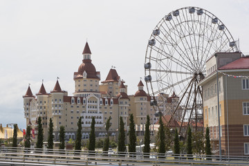 View of the hotel complex "Hercules" and a Ferris wheel with Olympic Park, Adler, Krasnodar region, Russia