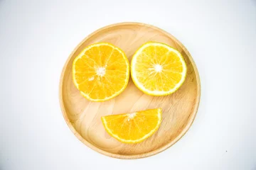Foto op Plexiglas Orange put on a wooden plate To feel happy, smiling, funny. © chaisiri