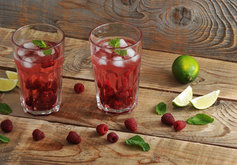 fruit lemonade with raspberries and ice, lime and mint