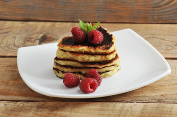 pancakes in the shape of hearts with raspberries
