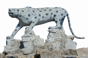 Sculpture cheetah on the stones isolated on white background
