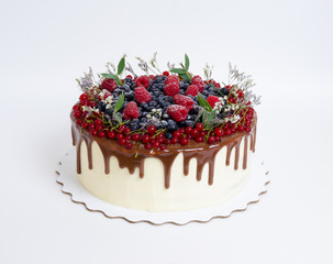 Delicious chocolate color drip cake with berries