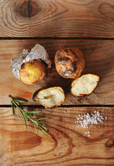 Fototapeta premium potatoes baked in foil on a wooden background