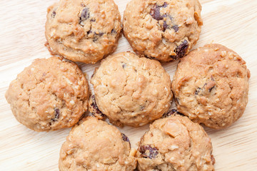 Close up texture of oatmeal cookies on wooden background.