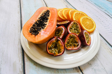 Tropical exotic fruit plate on wooden background
