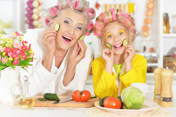Senior woman and granddaughter at kitchen