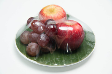  fruit in a plate on a white background
