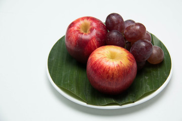  fruit in a plate on a white background