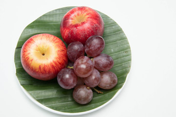  fruit in a plate on a white background