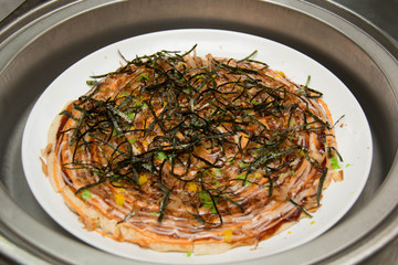Japanese Okonomiyaki is japanese pizza