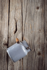metal kitchen accessories on wooden background, still life