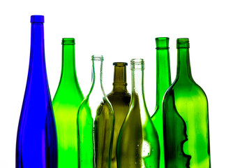 colored empty glass bottles for wine isolated on white background