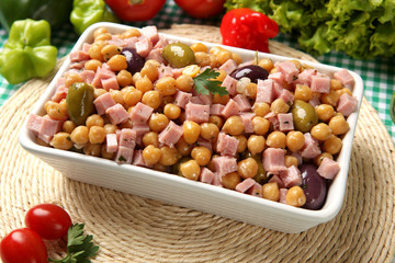Chickpea Salad, with some ingredients in the background.