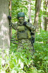 Forces soldiers in the woods with a Kalashnikov