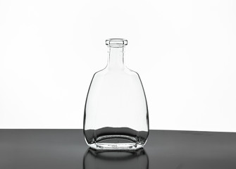 Transparent empty bottle on a white background
