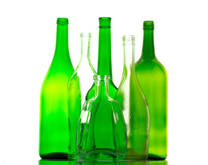 colored empty glass bottles for wine isolated on white background