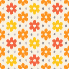 Ikat fabric pattern, abstract floral pattern with yellow and orange flowers. Seamless vector background.  Vector illustration. Oriental rug pattern, in yellow, orange and red.