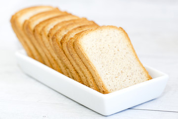 A group of rusks on a white platter