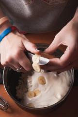 Obraz na płótnie Canvas Hands of a young girl kneading the dough,