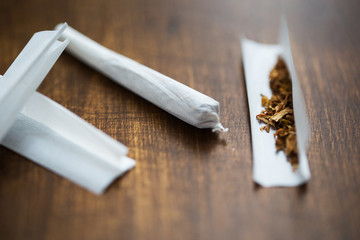 close up of marijuana joint and tobacco