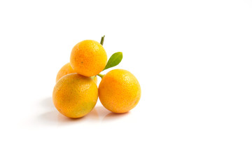 Orange Kumquat placed on whte background