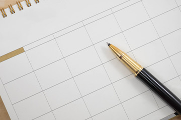 close up empty calender and pen