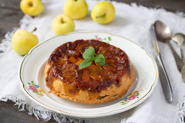 Homemade apple pie with caramel and fresh apples, rustic style, selective focus