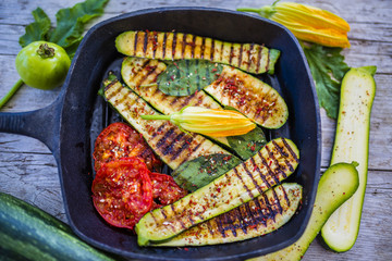 Grilled zucchini with tomatoes and sage