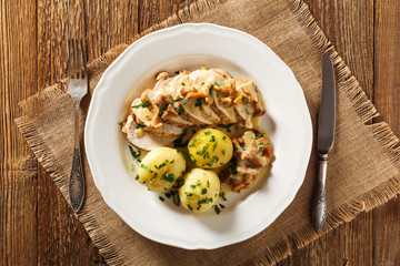 Roasted chicken breast served in a mushroom chanterelle sauce.